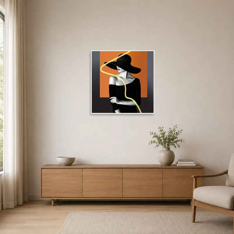 The minimalist space is enhanced by a chic noir portrait with neon accent.