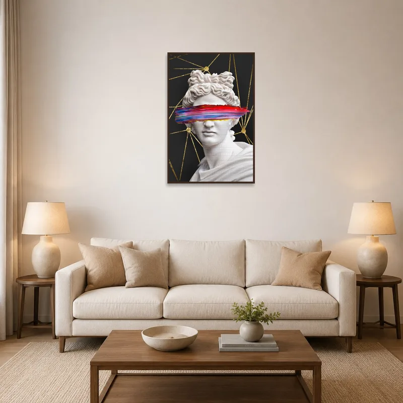 Classic bust print displayed above a modern sofa in a cozy living room.