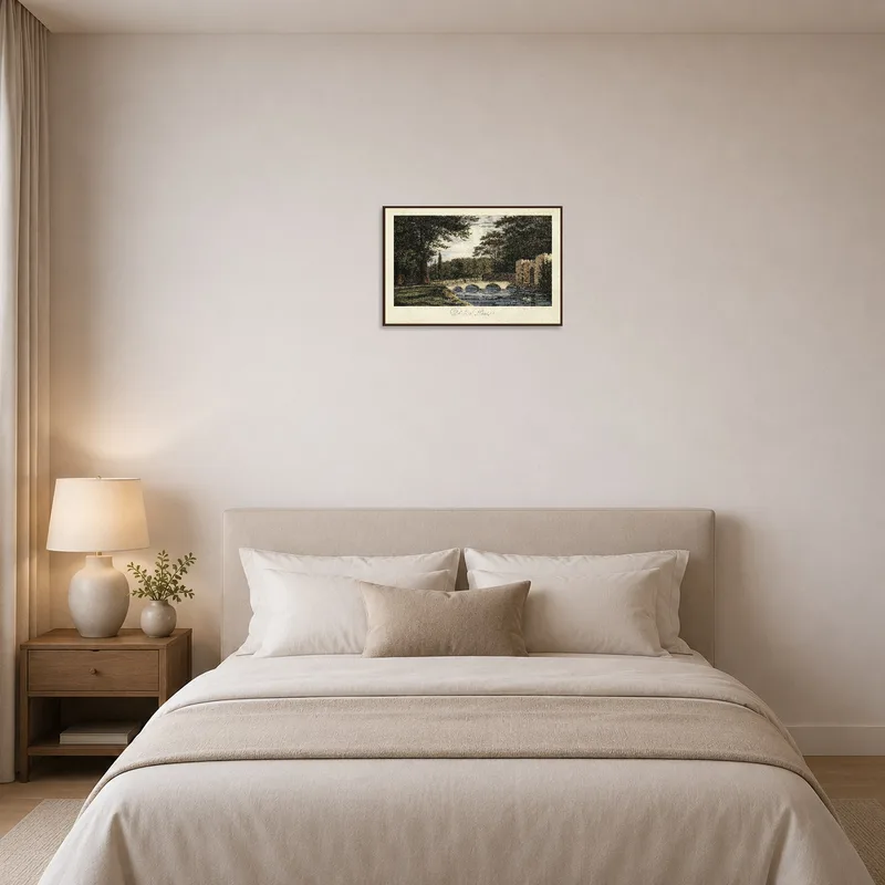 Quiet landscape artwork featuring a bridge and trees in the bedroom.