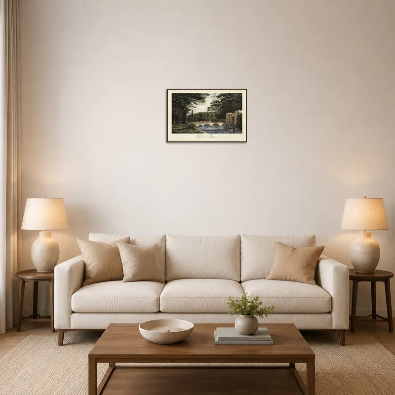 Artwork depicting a serene landscape with a bridge and trees in a cozy living room.