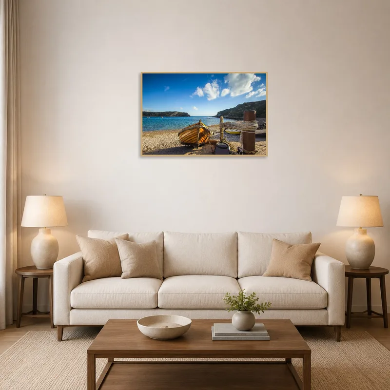 A wooden boat on a rocky shore above a couch in the living room.