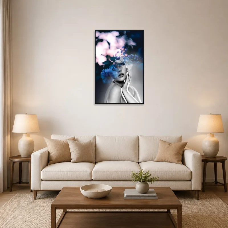 Double exposure art with florals hangs above a modern sofa in the living room.