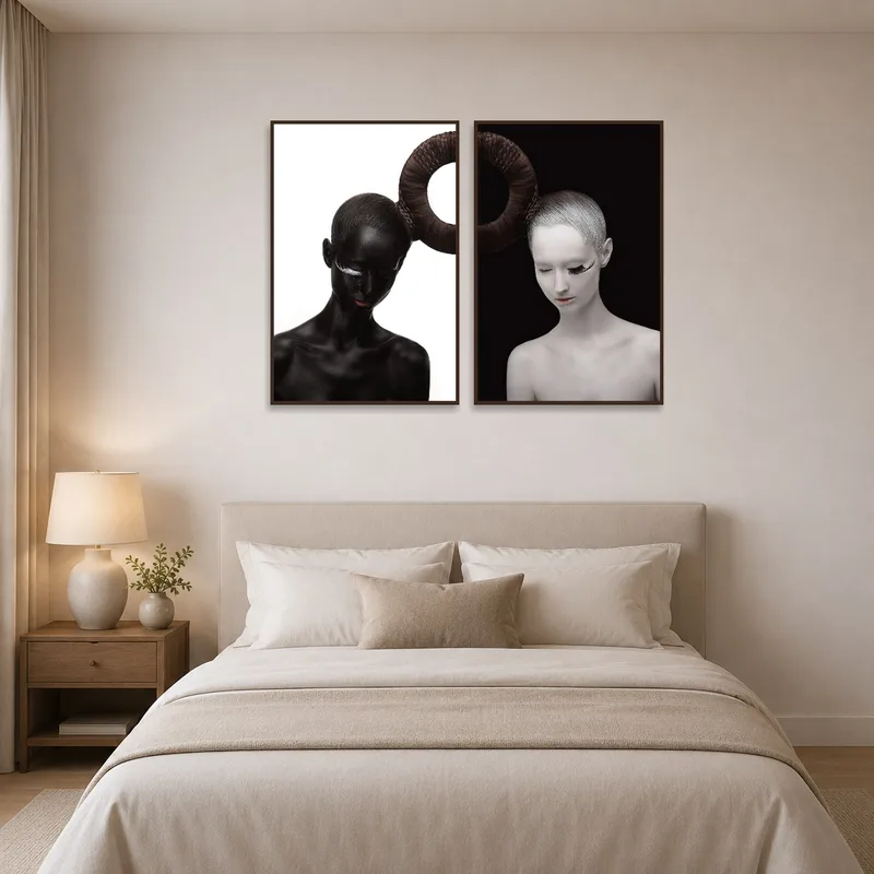 Duality portraits create visual interest in an elegant bedroom.