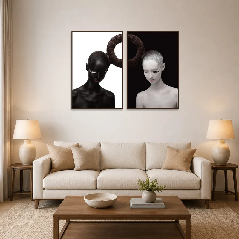 Black and white portraits add contrast to a stylish living room wall.