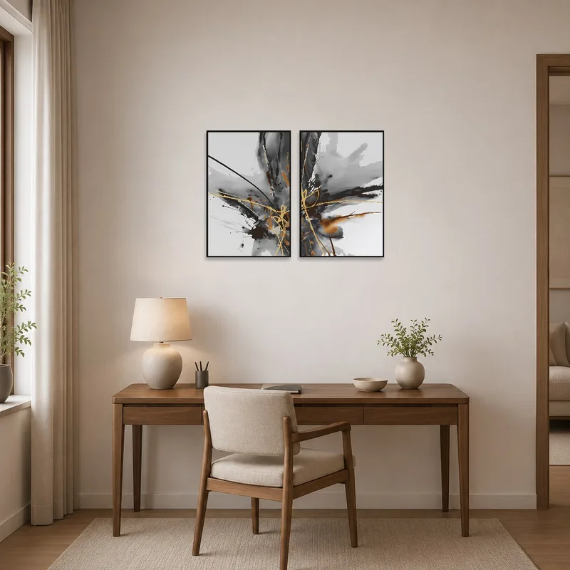Home office with a touch of creativity provided by black, brown, and gold abstract art.