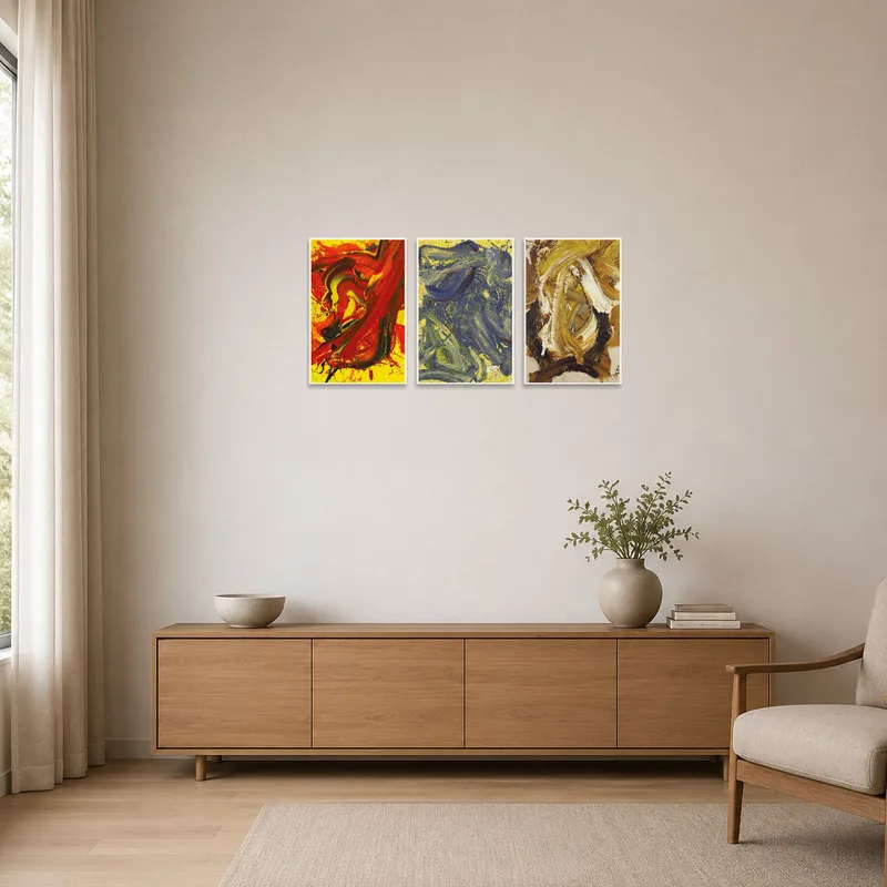 Vibrant abstract triptych adds color to a minimalist room setting.