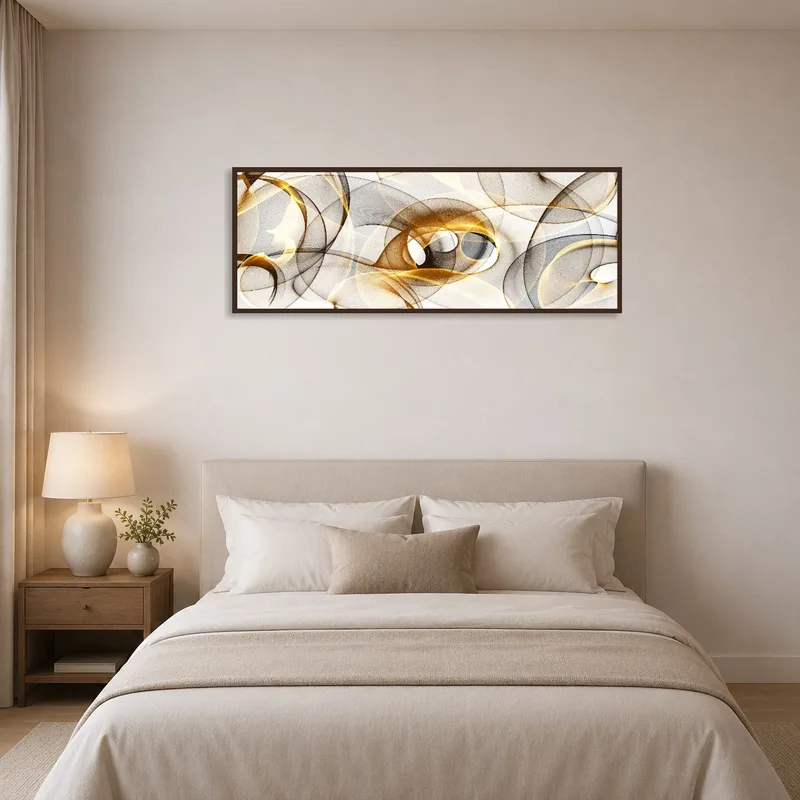 Abstract wave art adds color next to a bed with patterned pillows.