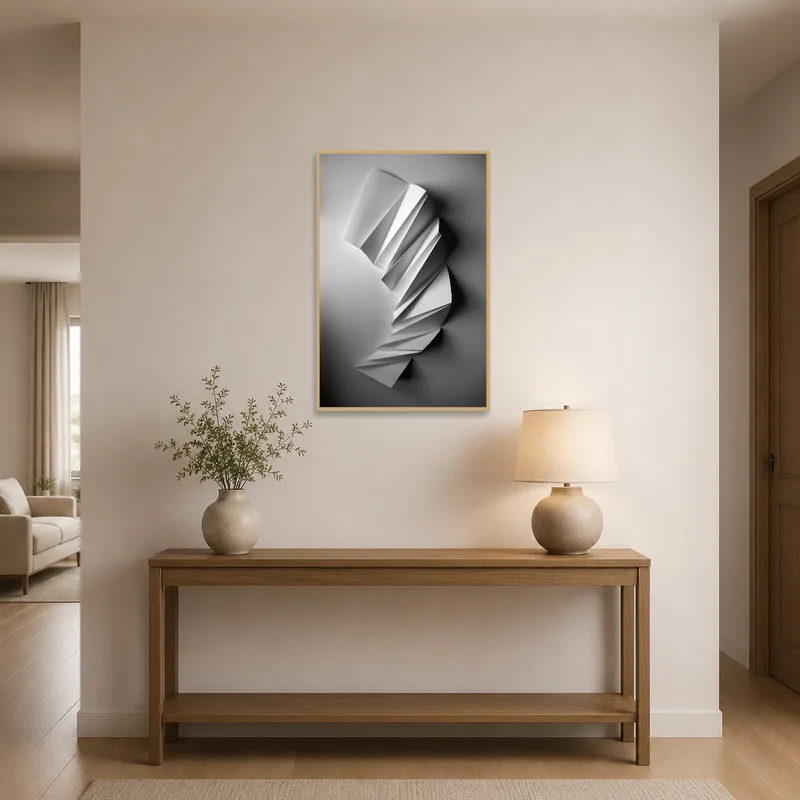 Striking monochrome paper sculpture print adorning entrance hall wall near door.