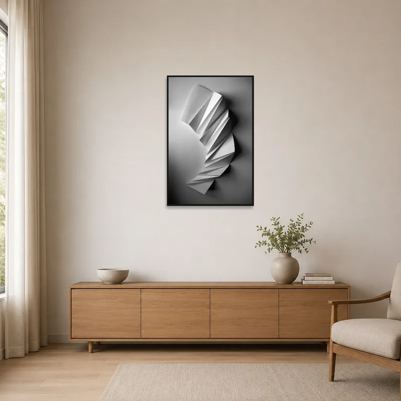 Sleek monochrome paper sculpture print on minimalist room wall with sparse furnishings.