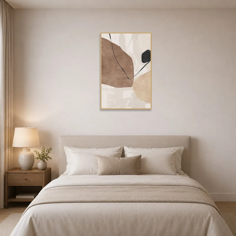 Earthy-toned abstract art adding warmth above a serene bed.
