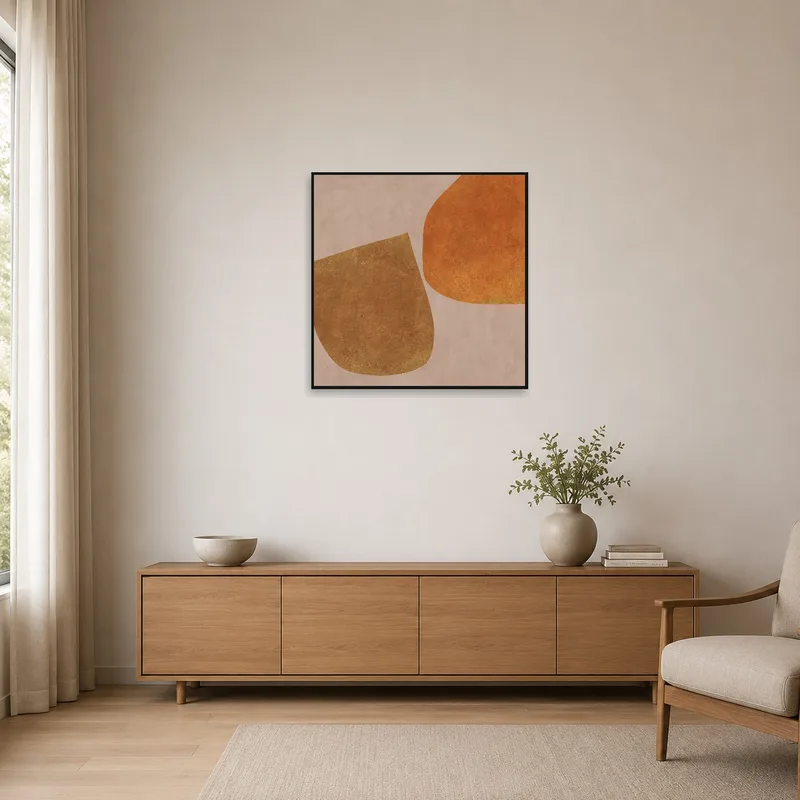 Earthy geometric art adds warmth to a minimalist room with natural tones.