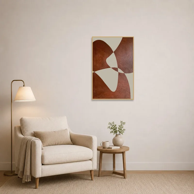 Earthy geometric wall art adding character to a snug reading corner with a comfy chair.