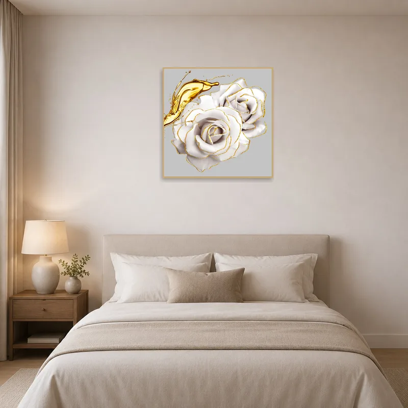 White roses with gold accents above a serene bed.