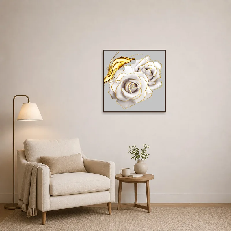 White roses with gold accents by a comfy reading chair.