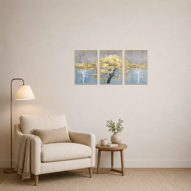 Gold and gray tree art enhances the peaceful atmosphere of a cozy reading corner.
