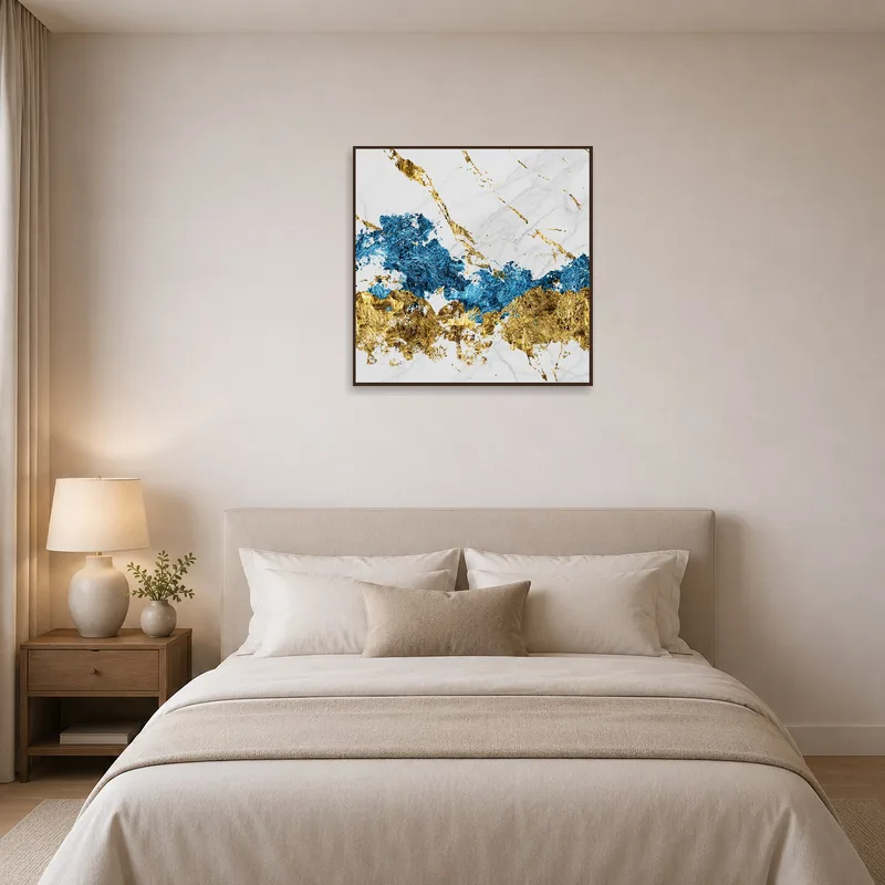 Sophisticated blue and gold marble piece adds elegance to a serene bedroom.