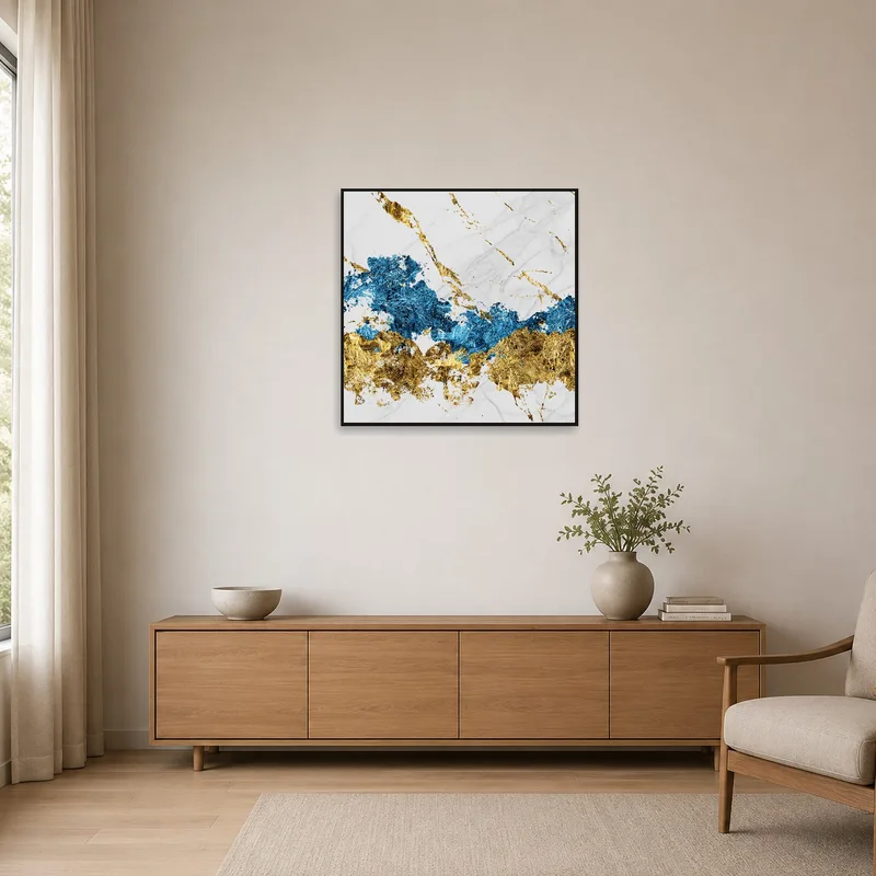 Blue and gold marble artwork complements a minimalist room's clean lines.