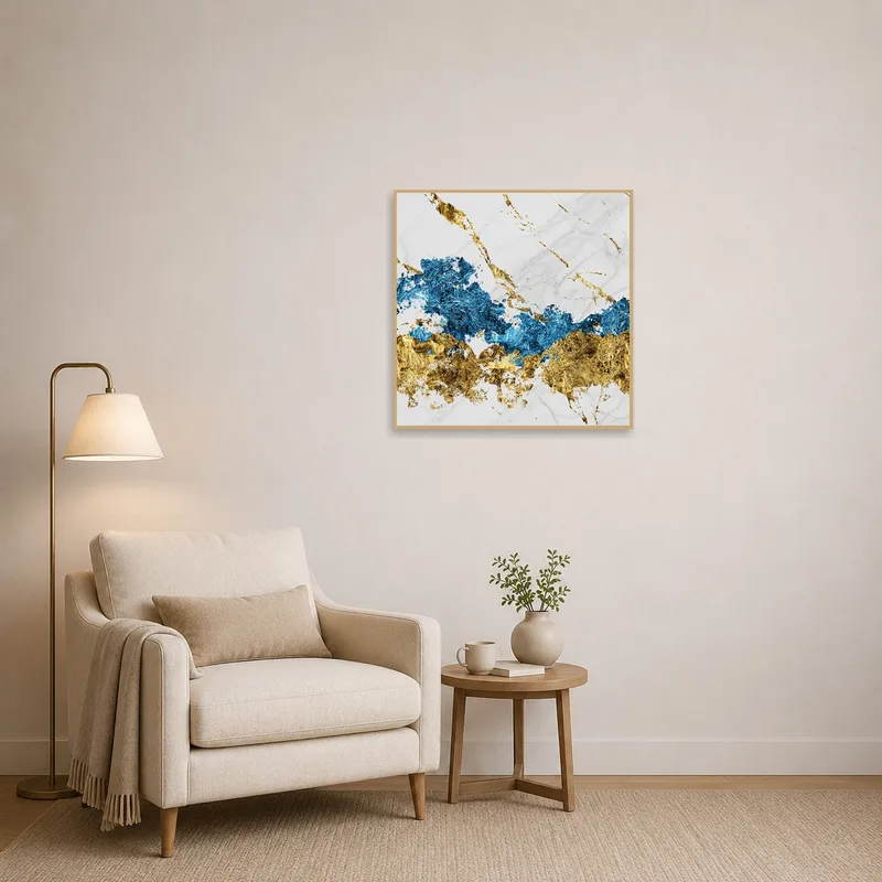 Abstract marble art in blue and gold brightens a cozy reading corner.