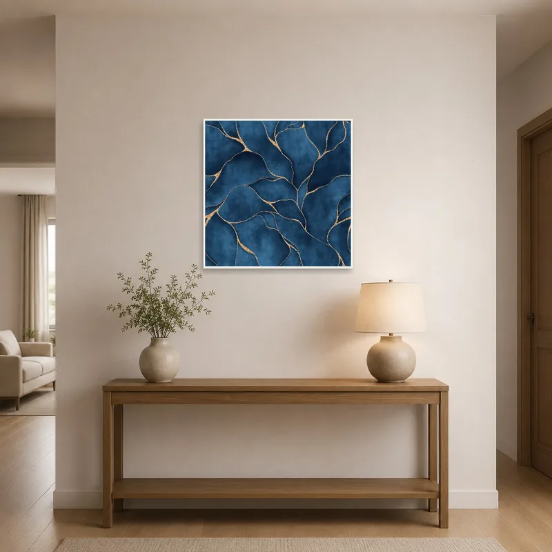 Elegant abstract artwork in blue and gold adorns a chic entrance hall.