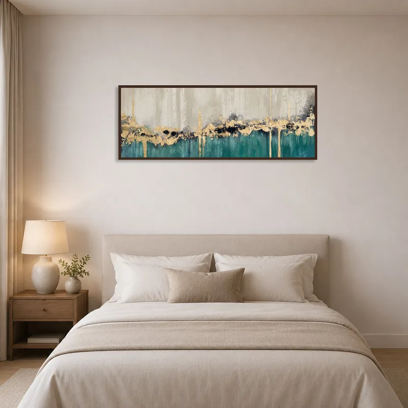 Abstract brushstroke artwork with gold tones hanging in a stylish bedroom.