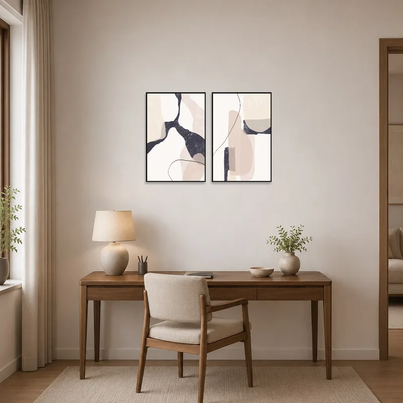 Abstract art in neutral hues adorns the wall of a sleek home office.