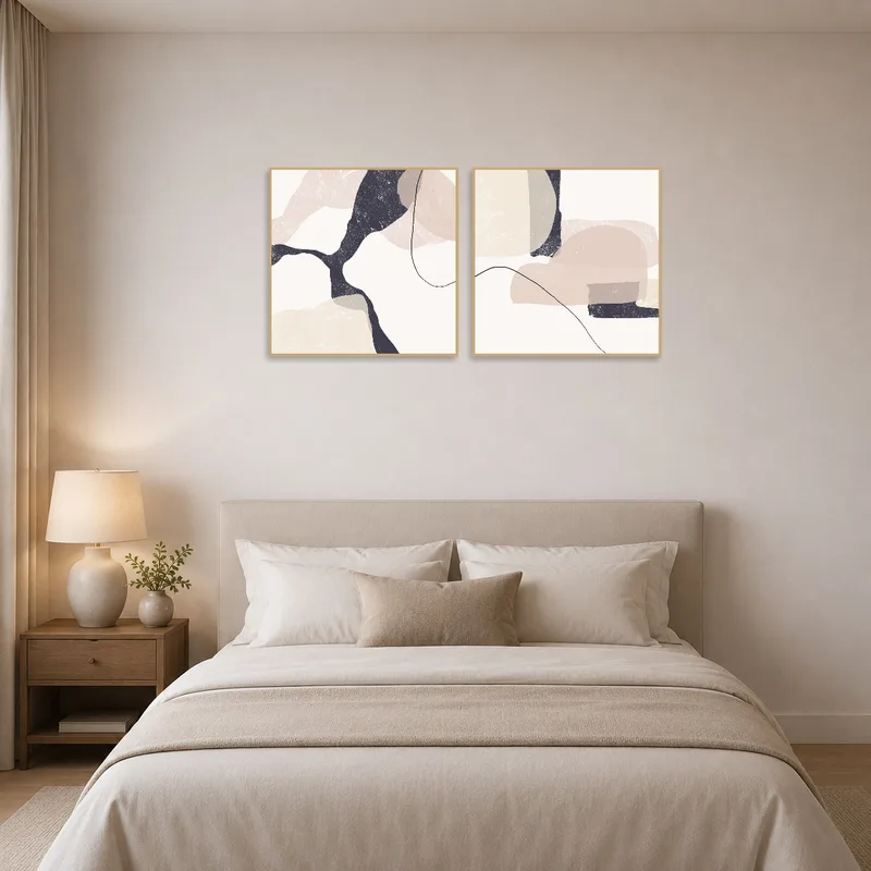 Abstract duo art provides a calming touch in a stylish bedroom.