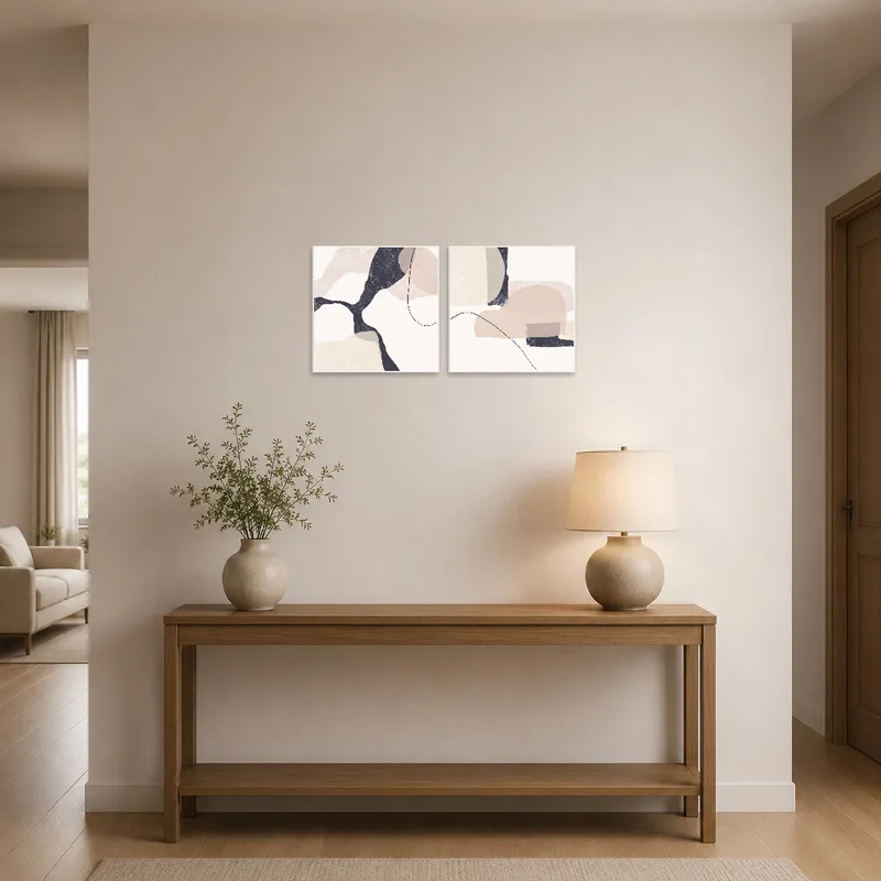 Abstract duo art welcomes guests in a chic entrance hall.