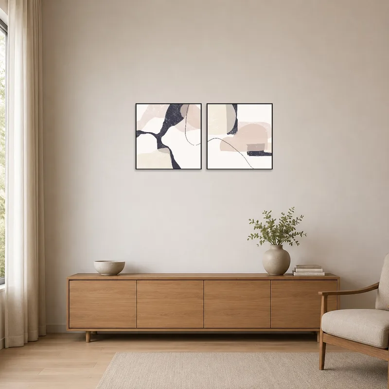 Abstract duo art adds elegance to a minimalist room with clean lines.