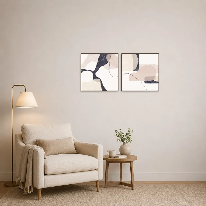 Elegant abstract duo art enriches a serene reading corner.
