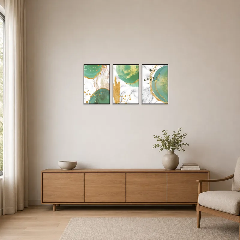 Minimalist room features an elegant abstract emerald and gold triptych set.