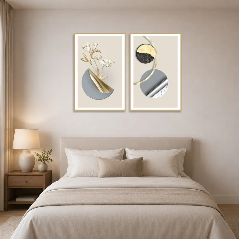 Elegant set of abstract floral and geometric prints above a bedroom headboard.
