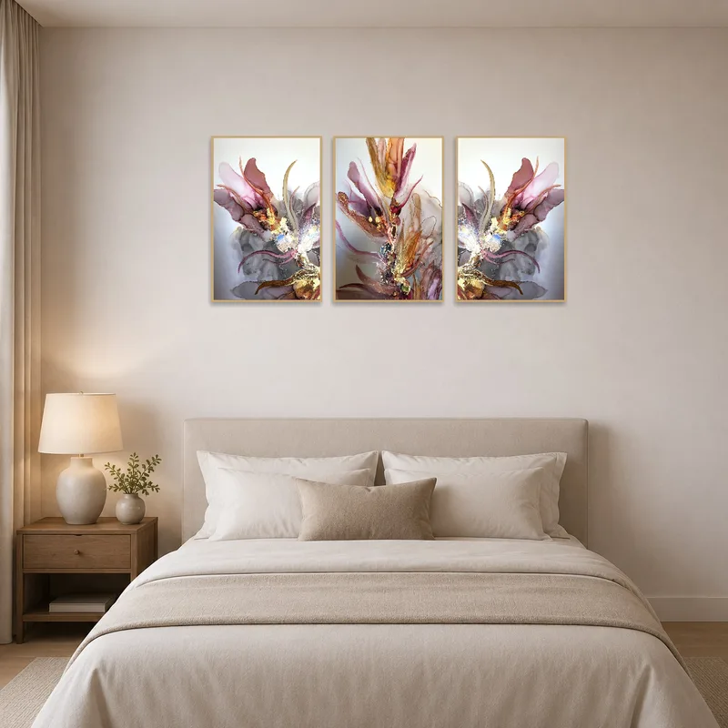 Elegant floral triptych hangs over a bed, complementing serene bedroom decor.