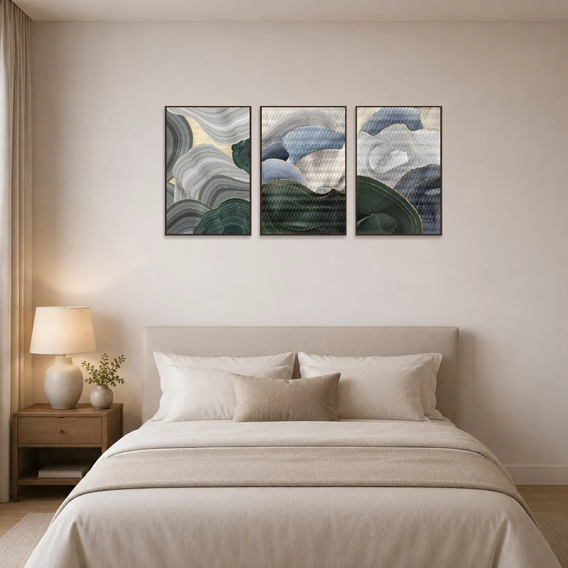 Triptych with abstract designs adding elegance to a modern bedroom.