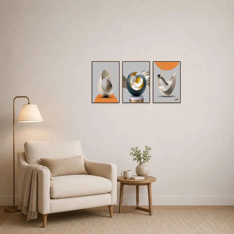 Artistic triptych set beside a cozy chair in a reading corner.