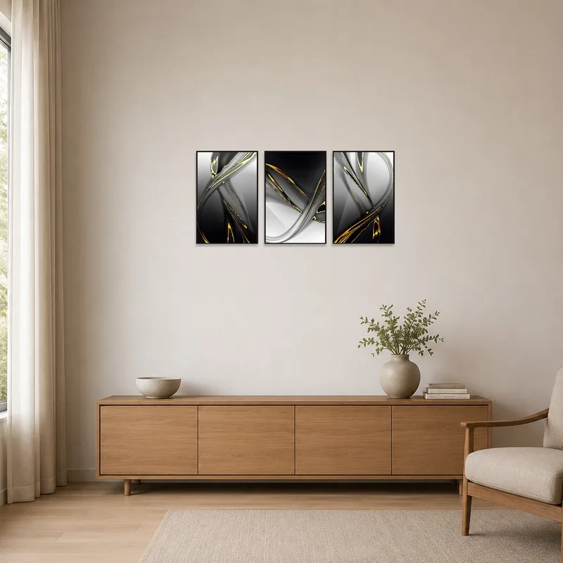 Minimalist space highlights a gold and black abstract triptych on a clean, white wall.