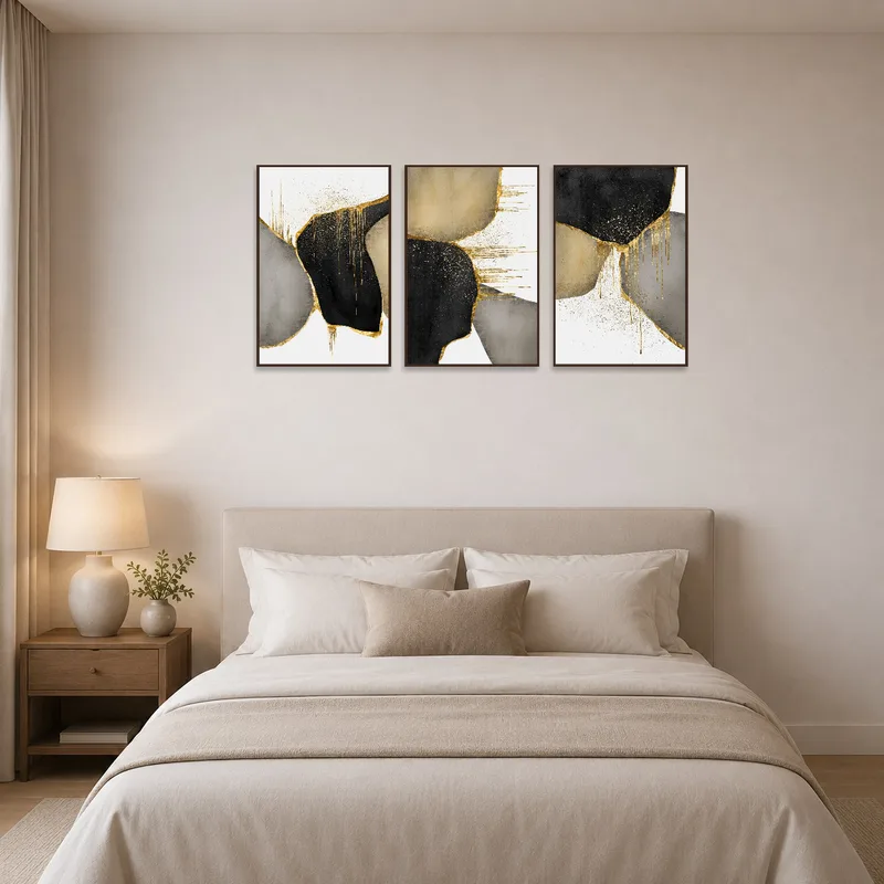 Calming bedroom with gold and black abstract art as headboard decor.