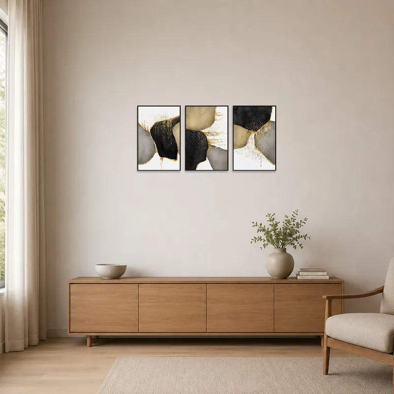 Minimalist room with abstract gold and black art as a focal point.
