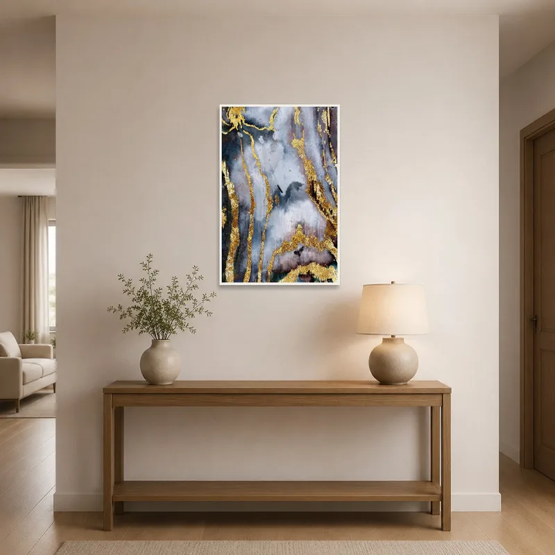 Vertical abstract art in gold and gray gracing an elegant entrance hall.