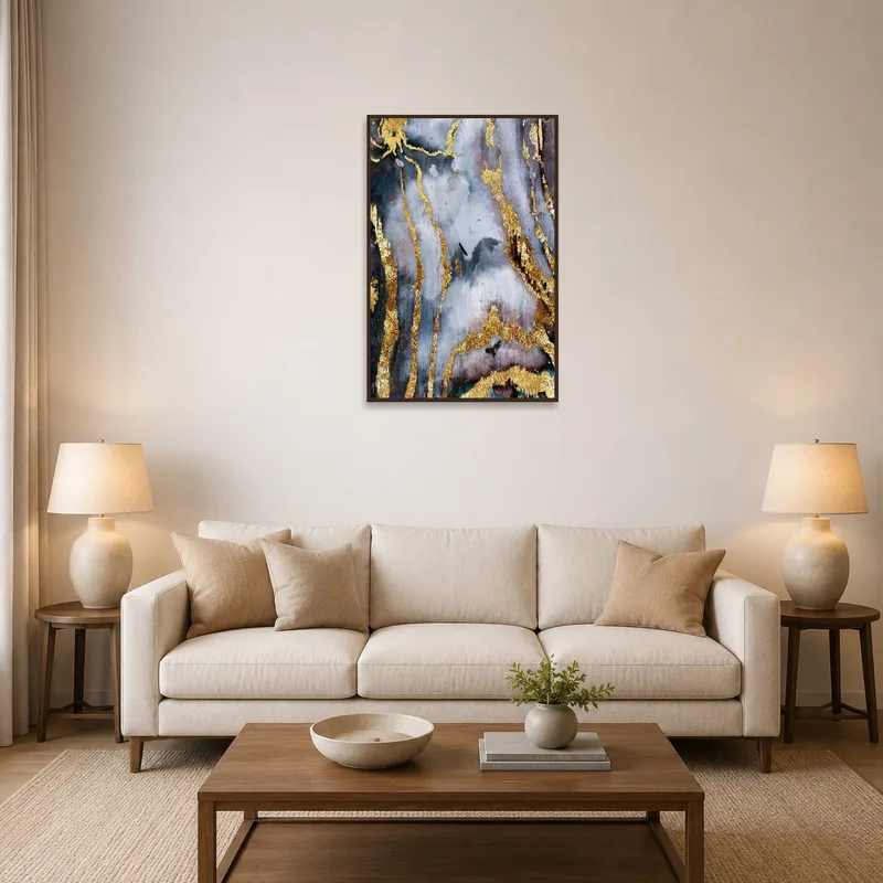Elegant abstract gold and gray art on a living room wall with neutral decor.
