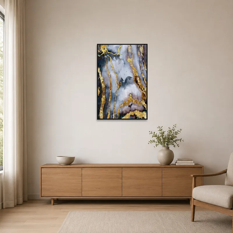 Gold and gray abstract art in a minimalist room with clean lines and simple furniture.