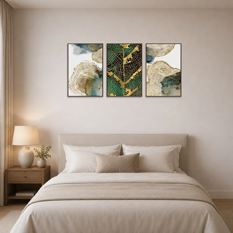 Gold and teal abstract triptych adds a touch of sophistication to a calming bedroom decor.