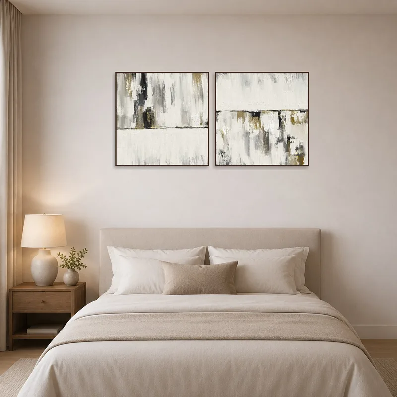 Elegant abstract diptych brings serene vibes to a bedroom.