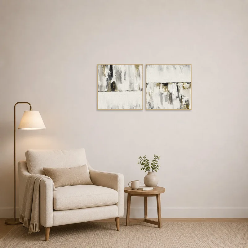 Neutral brushstroke diptych adds tranquility to a reading corner.