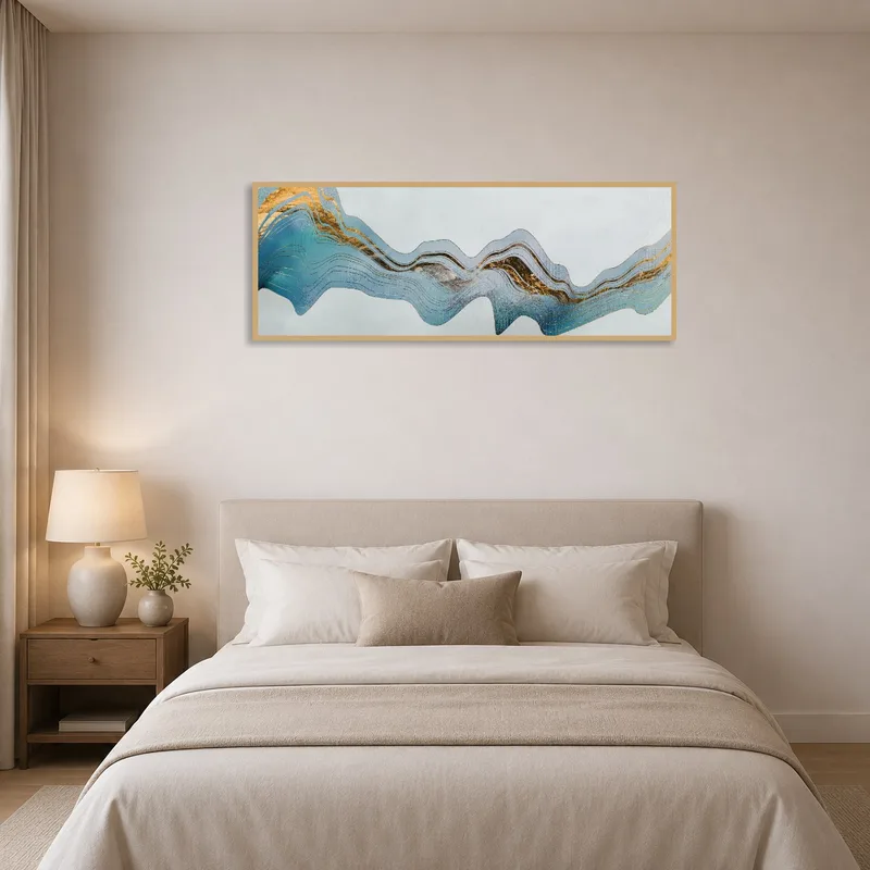 Abstract gold-accented artwork colorfully complementing a bedroom's style.