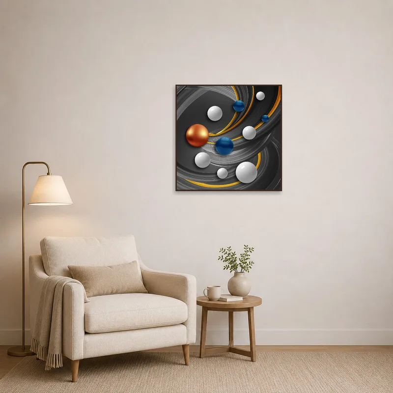 Spheres and curves art by a comfy reading chair.