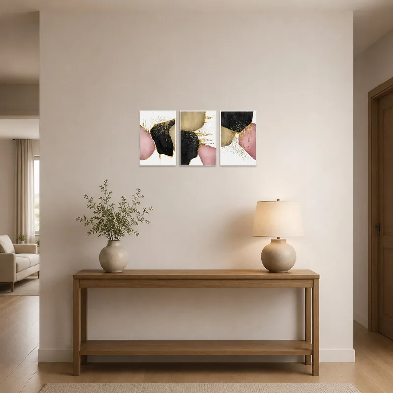 Abstract triptych welcomes guests in a stylish entrance hall.