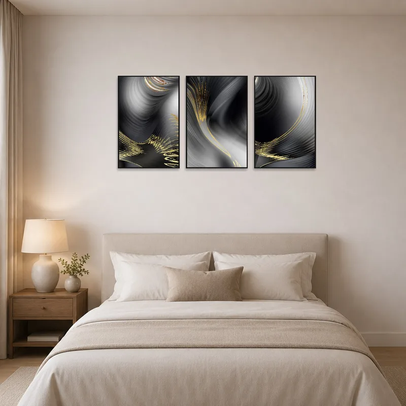 Abstract triptych in grey and gold adding elegance to the bedroom ambiance.