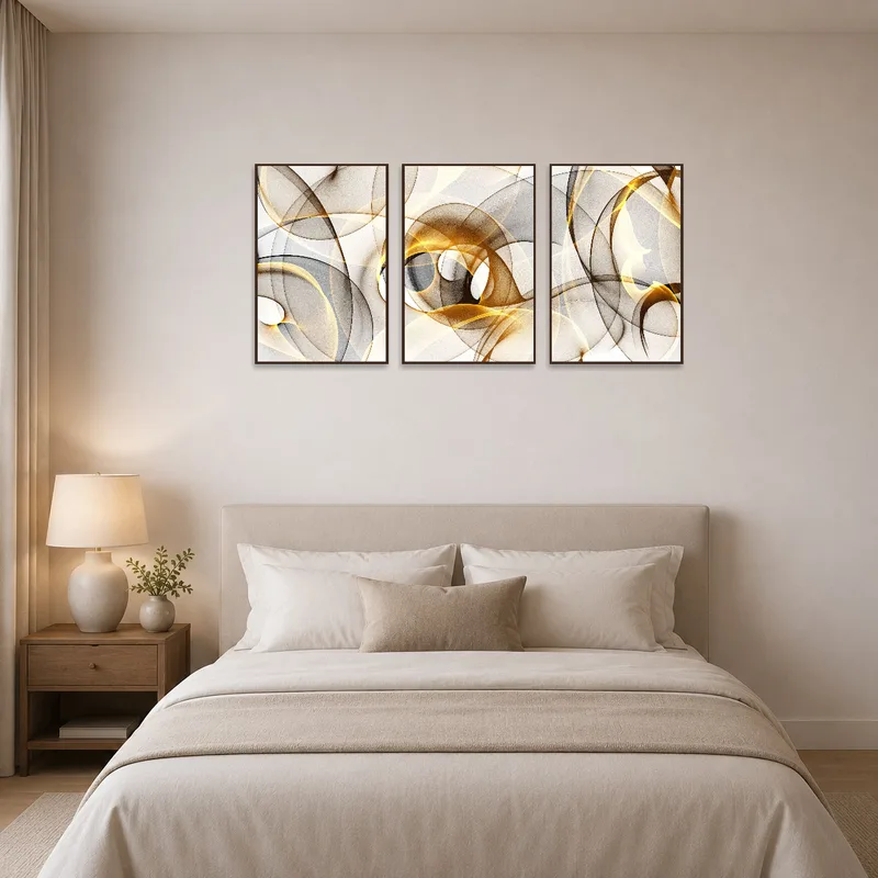 Elegant abstract triptych adding flair to a serene bedroom.