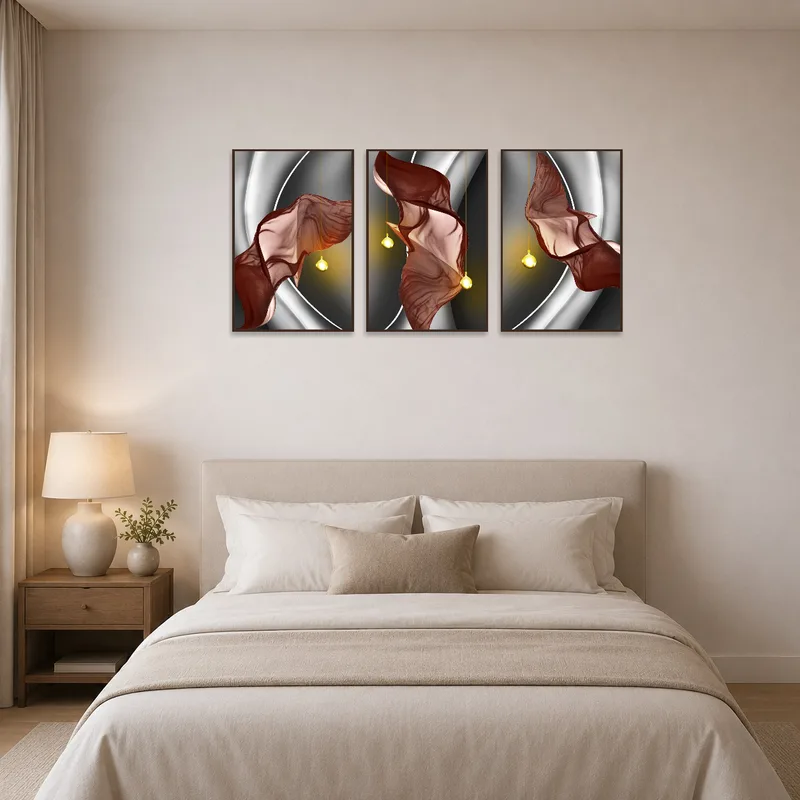 Elegant flowing fabric triptych art adorns a serene bedroom wall.