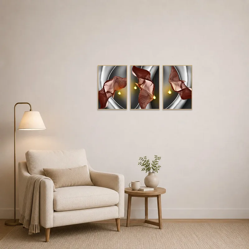 Triptych with flowing fabric abstract art in a cozy reading corner.